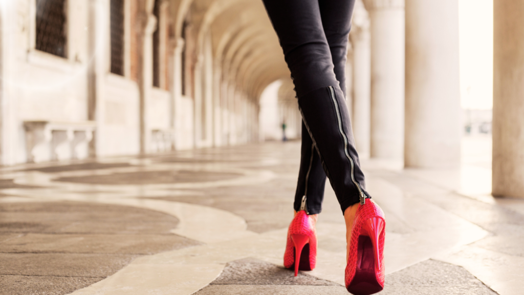 Lady in heels walking down the street.